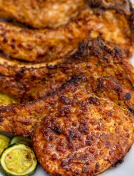 juicy air fried pork chops arranged on a plate